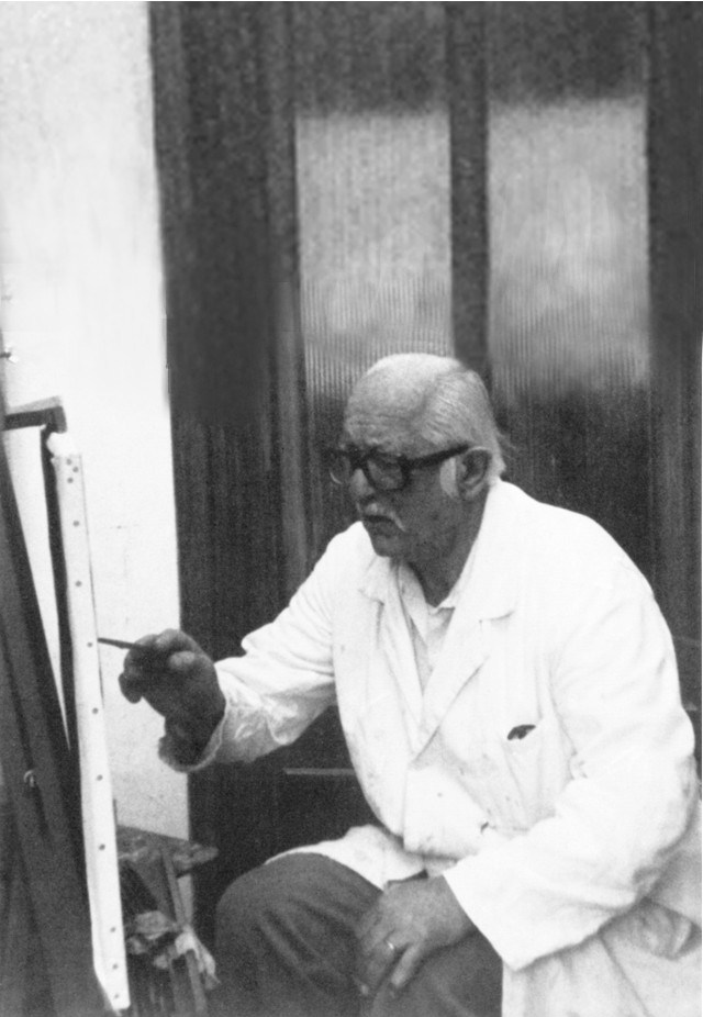 Léon Markarian en train de peindre une toile